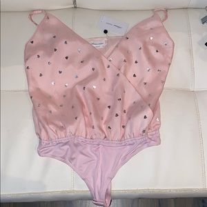 Pink body suit Lover + Friends